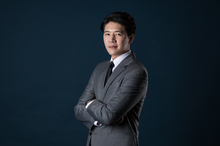 Portrait of a happy Asian business manの写真素材