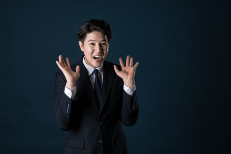Portrait of a happy Asian business manの写真素材