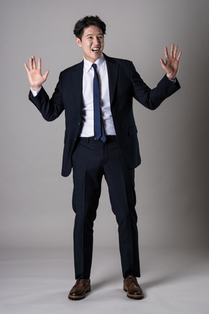 East Asian businessman shooting studio portrait photoの写真素材