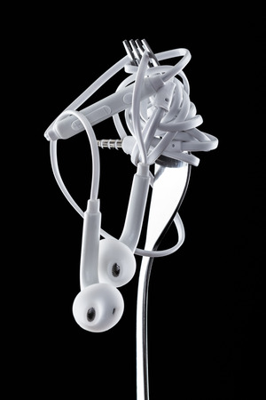 Earphone on black background. Concept of Musicの写真素材
