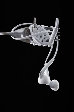 Earphone on black background. Concept of Musicの写真素材