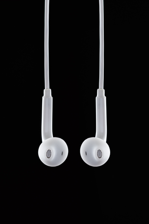 Still life shooting of earphones in studio with black backgroundの写真素材