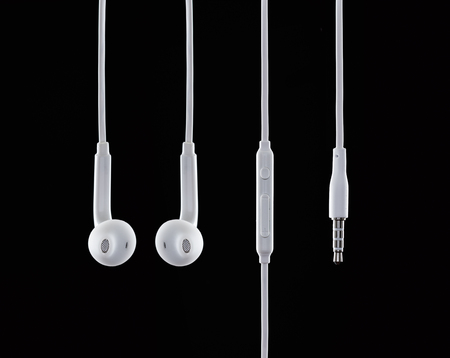 Still life shooting of earphones in studio with black backgroundの写真素材