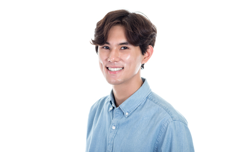 Studio portrait of a happy and handsome asian manの写真素材