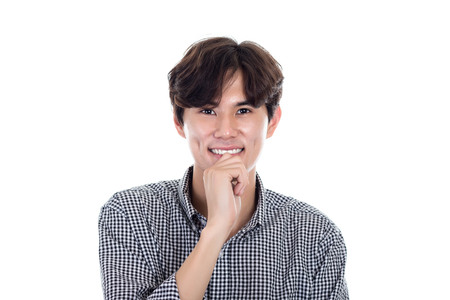 Studio portrait of a handsome asian man having a happy worryの写真素材