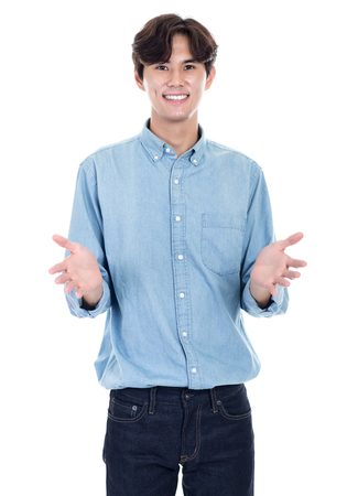 Portrait of an Asian man with both hands openの写真素材