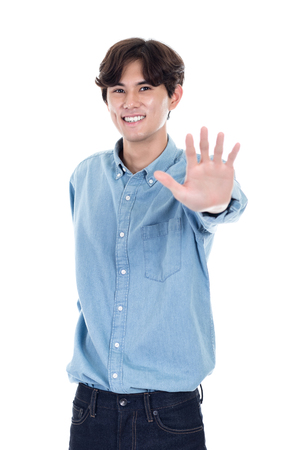 Studio portrait of Asian man using a handの写真素材