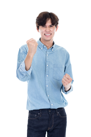 Studio portrait of Asian man expressing successの写真素材