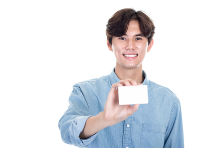 Studio portrait of an Asian man holding a cardの写真素材