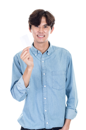Studio portrait of an Asian man holding a cardの写真素材