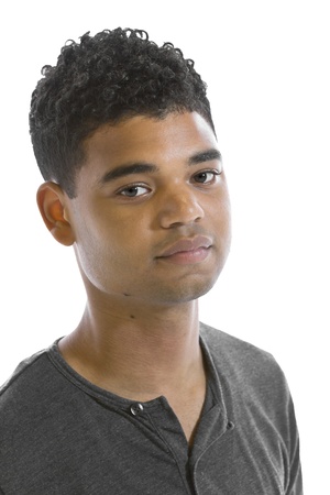 Handsome young black man standing in front of white backgroundの写真素材