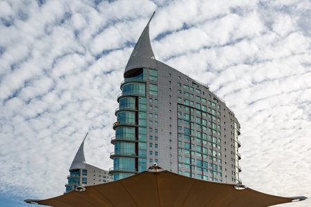 Stylish residential building with a sail-like roof in Lisbons Parque das Nacoes, Portugalの写真素材