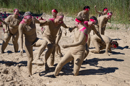 Munich, Germany - July 1, 2018: Team spirit and fun during Muddy Angels breast cancer beneficial eventのeditorial素材