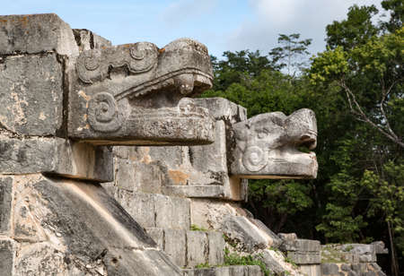Snake head sculptures at the plaform of eagles and jaguars, Chichen-Itza, Yucatan, Mexicoの写真素材