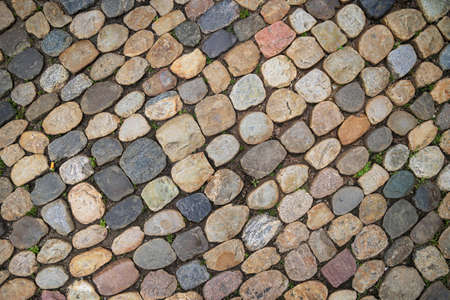 Old rounded cobblestone pavement in old town of Freiburg im Breisgau, Baden-Wuerttemberg, Germanyの写真素材