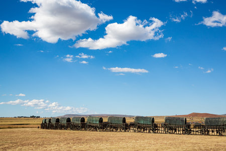 Circle of 64 replica Voortrekker wagons cast in bronze at Blood River Heritage Site, KwaZulu-Natal,...