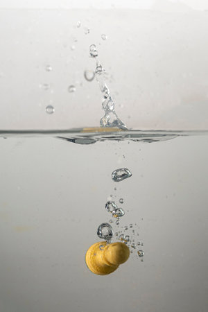 Some chess pieces drop with a splash in clear waterの写真素材