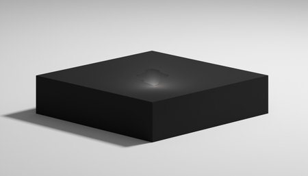 A black square object casting a shadow on a white surface, creating a minimalist composition.の素材