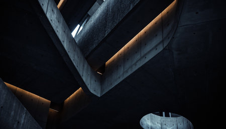 Low angle view of industrial interior with metal beams and lighting fixtures in a dark settingの素材