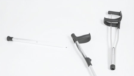 Three crutches displayed on a plain white background, ideal for medical or healthcare contexts.