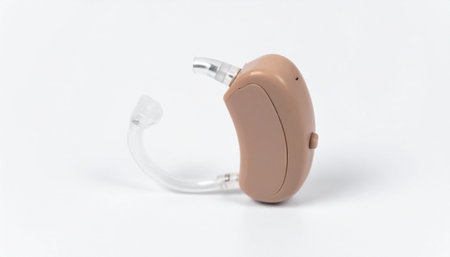 Beige colored hearing aid with transparent tube