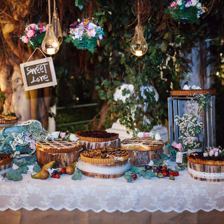 Table full of cakes and sweetsの写真素材