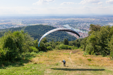 Paraglider running for take offの写真素材