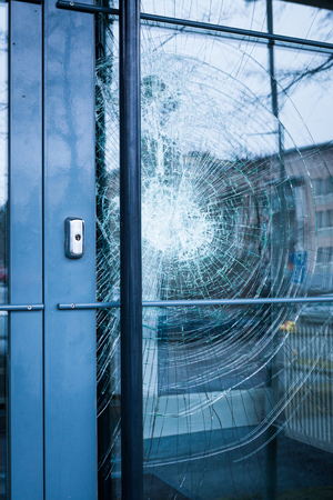 Broken glass front door outsideの写真素材