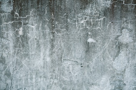 Messy stained concrete wall texture backgroundの写真素材