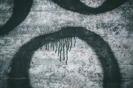 Weathered concrete wall texture and black paint dripping