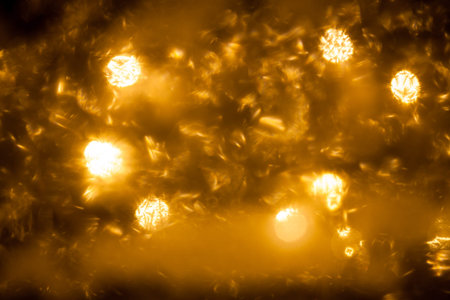 Rime on window and christmas light bokeh on background