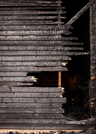 Burnt broken wood wall background textureの写真素材