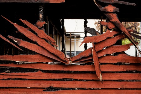 Burnt broken wood wall background textureの写真素材