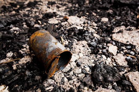 Abandoned tin can on burned groundの写真素材