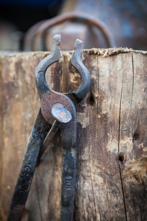 Worn old iron pliers closeupの写真素材