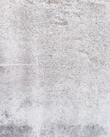 Worn grey cement stone wall background textureの写真素材