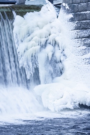 Icicles and ice formation in waterfallの写真素材