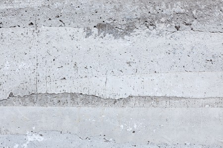 Worn concrete wall closeup texture backgroundの写真素材