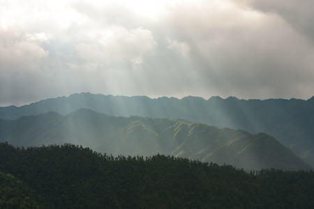 Light rays over mountain landscape chinaの写真素材