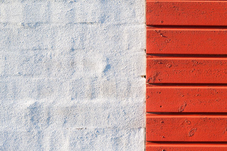 Painted white brick wall and red wooden wall textureの写真素材