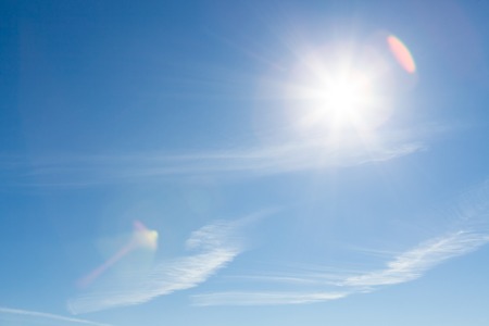 Sun shining blue skyの写真素材