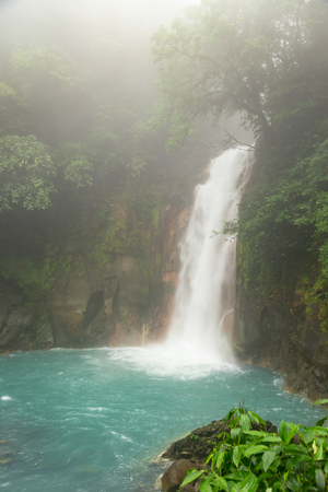 Rio celeste waterfall at foggy dayの写真素材