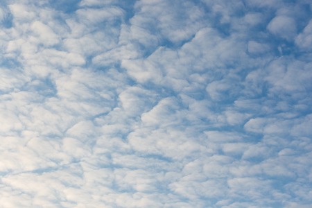 Calm sunset clouds and blue sky backgroundの写真素材