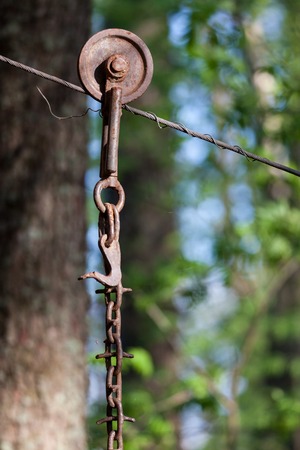 Old cable wire and hanging chainの写真素材