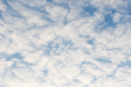 Calm sunset clouds and blue sky backgroundの写真素材