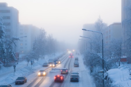 Small city street at cold foggy winter dayの写真素材
