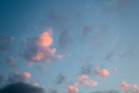 Pink clouds and moon heaven closeupの写真素材