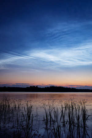 Night shining clouds over lake in Finland