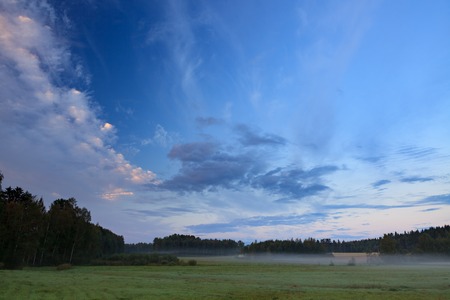 Summer morning at countryside field in Finlandの写真素材