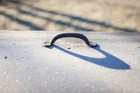 Handle on storage container outdoors in cold weatherの写真素材